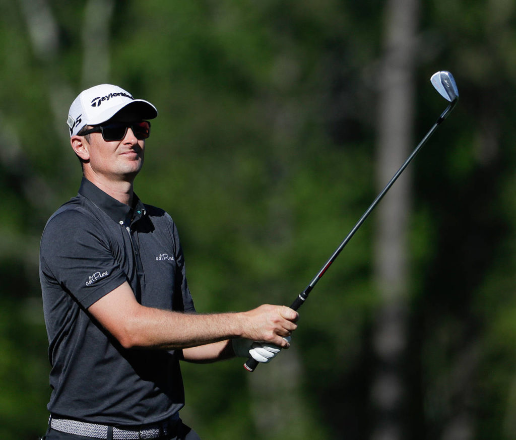 Justin Rose, of England, hits a shot on the 12th hole during the final round of the Masters golf tournament Sunday, April 9, in Augusta, Ga. (AP Photo/David Goldman)

