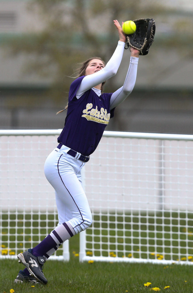 Lake Stevens’ Meghan McGinnis makes a catch in the outfield during Monday’s game in Lake Stevens. (Andy Bronson / The Herald)
