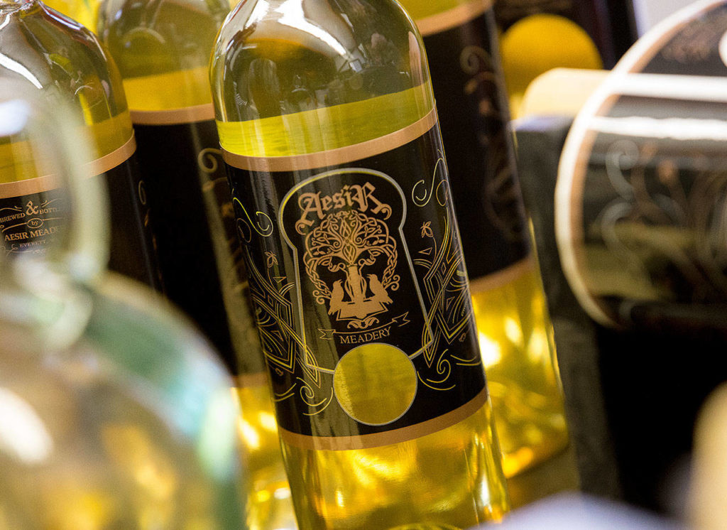 A newly labeled bottle of mead from Aesir Meadery at the shop in Everett. Owner Erik Newquist uses locally sourced honey, fruits and spices for his mead. (Andy Bronson / The Herald)
