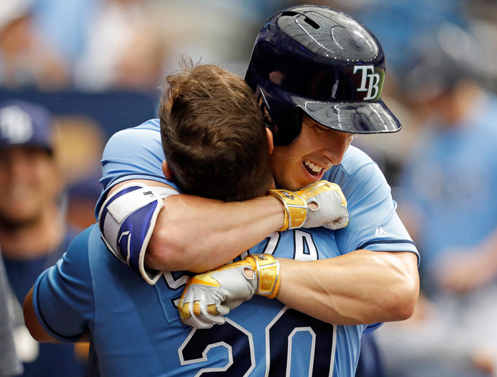 Tampa Bay Rays’ Corey Dickerson, right, hugs Steven Souza Jr. after his home run during the third inning of a baseball game against the Toronto Blue Jays, Sunday, April 9, 2017, in St. Petersburg, Fla. (AP Photo/Mike Carlson)
