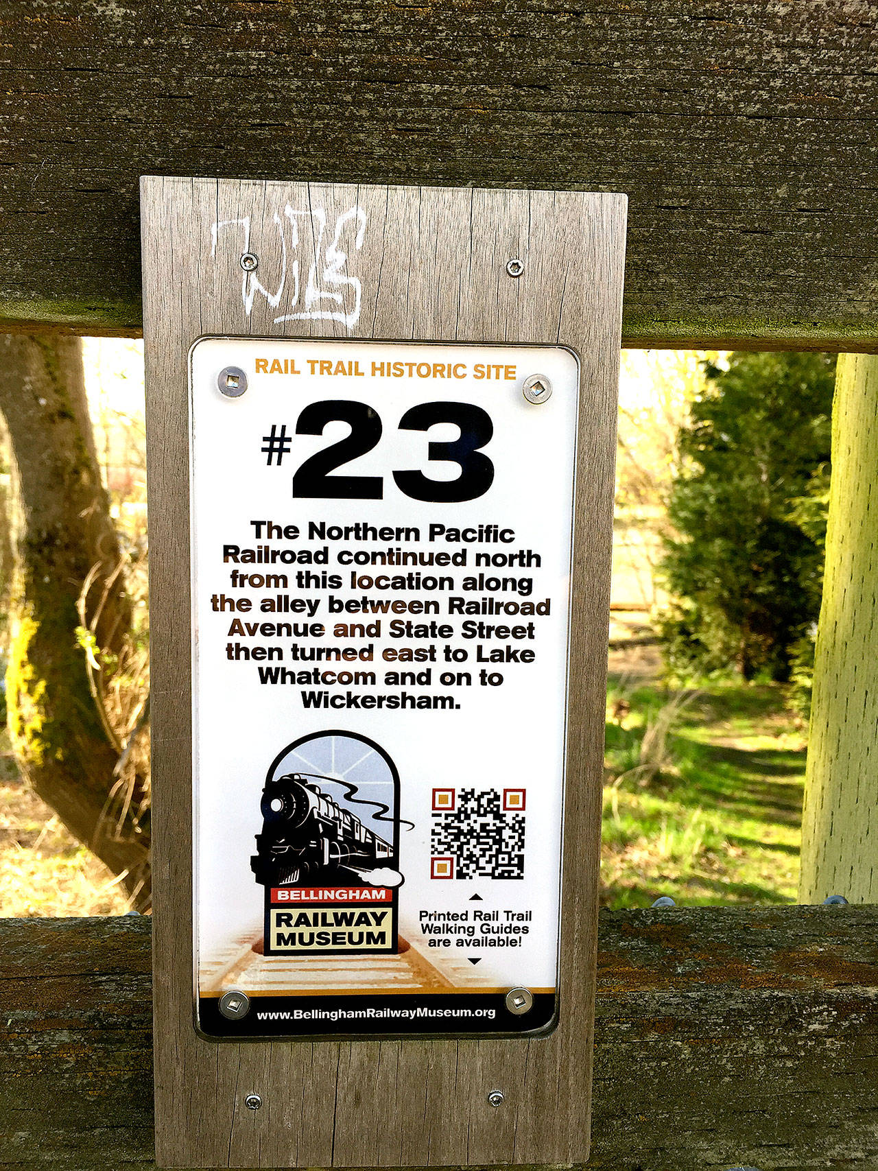 Small sign posts along the trail mark where the Northern Pacific Railroad once ran along the South Bay Trail between Fairhaven and Bellingham. (Aaron Swaney photo)