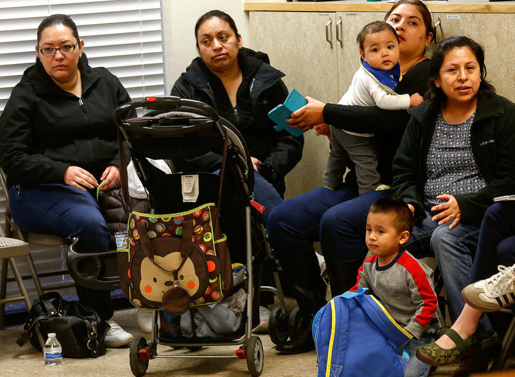 Casino Road-area mothers gather for a weekly coffee hour where they can bring their little ones to the nearby nonprofit Hand In Hand. (Dan Bates / The Herald)
