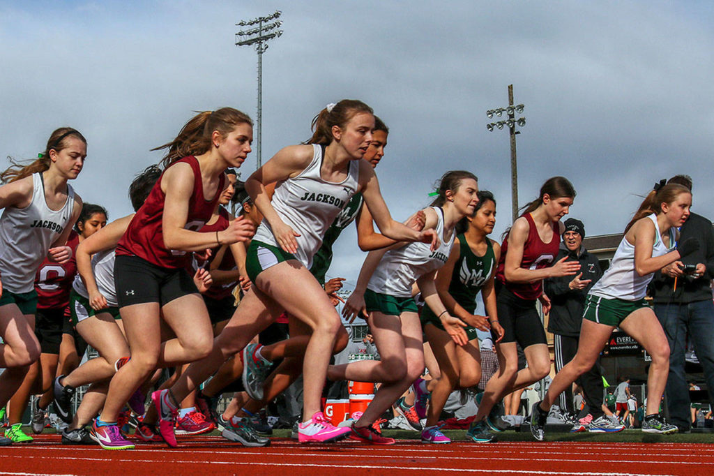 Athletes from Cascade, Mount Vernon and Jackson start the girls 3200 meters on Friday at Everett Memorial Stadium. (Kevin Clark / The Herald)
