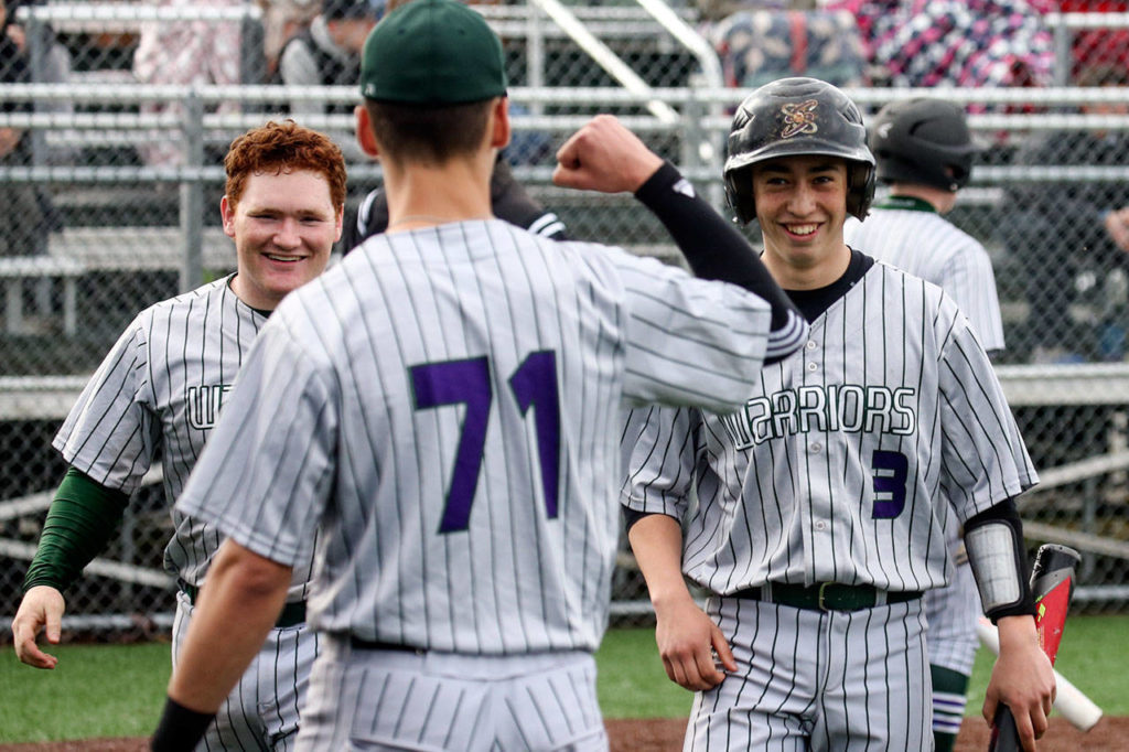 Edmonds-Woodway’s Julian Kodama (71) awaits teammates Sam Alvarado (right) and Garrison Krohn (left) after they scored during a game against Meadowdale on April 12, 2017, at Mountlake Terrace High School. (Kevin Clark / The Herald)
