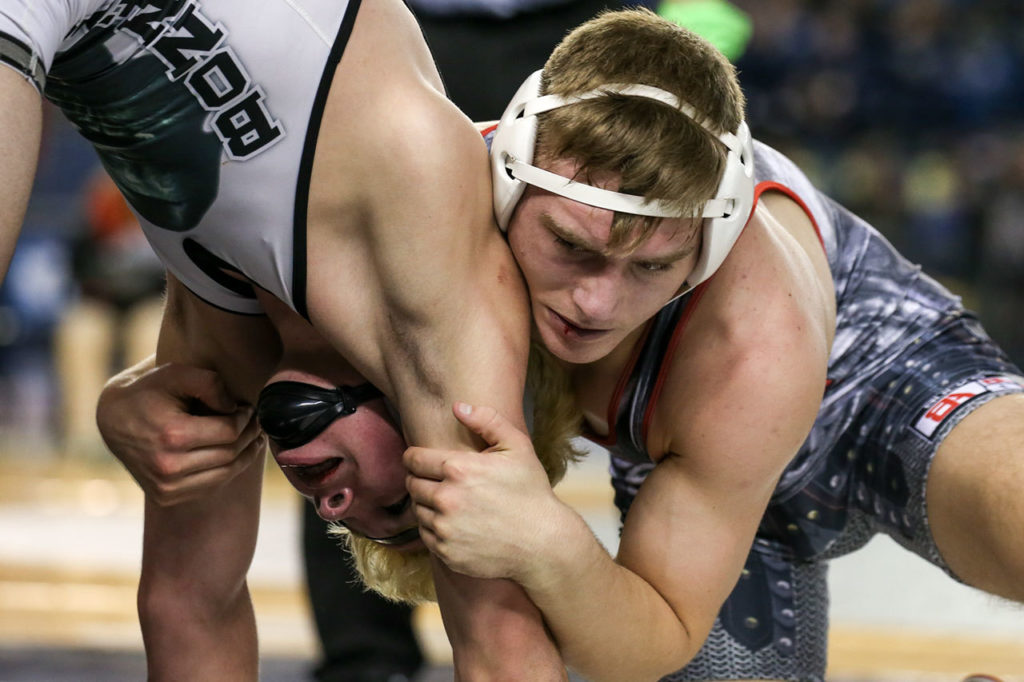 Bonney Lake’s Mason Sabin, left, wrestles Stanwood’s Mason Phillips in the 145lb weight-class during the Washington State MAT Classic XXIX Championships 2017 Saturday afternoon in Tacoma on February 18. The star grappler left Stanwood after the season ended to train and compete in Ohio. (Kevin Clark / The Herald)
