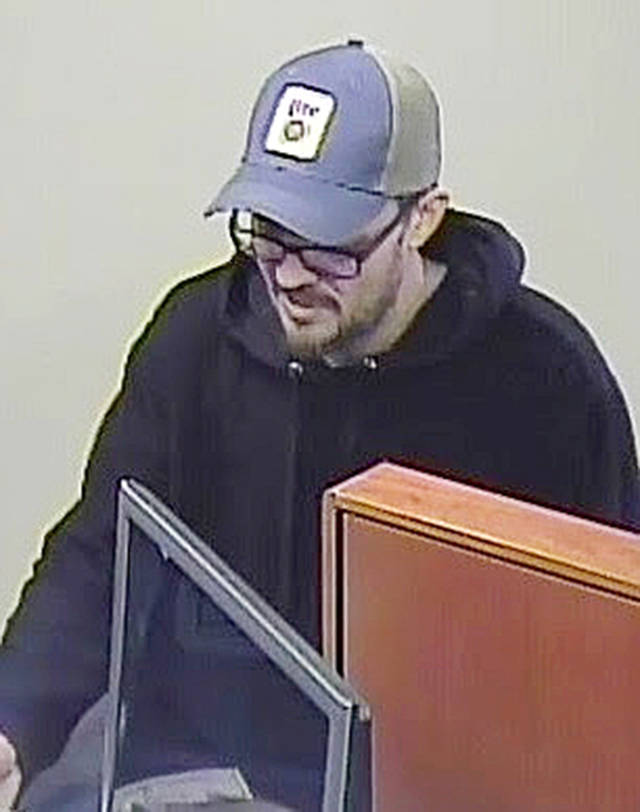 The suspect in the robbery of the Chase Bank on Highway 99 in Lynnwood on April 11, as seen on security video. (Lynnwood Police Department)