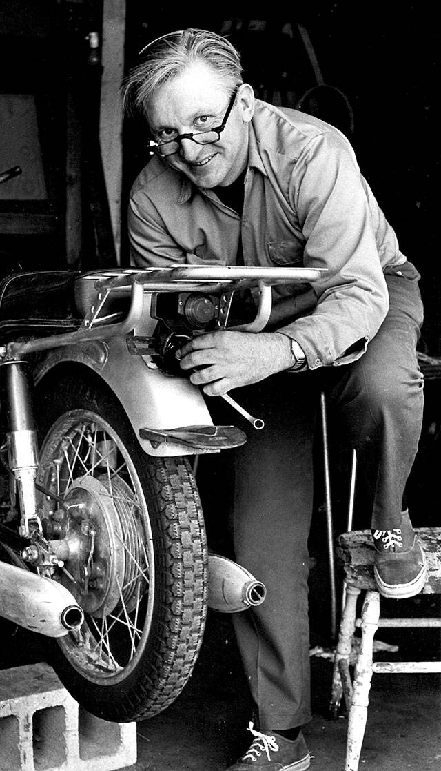 Robert M. Pirsig working on a motorcycle in 1975. Pirsig, whose novel “Zen and the Art of Motorcycle Maintenance” became a million-selling classic after more than 100 publishers turned it down, died at his home in South Benwick, Maine, on Monday. (William Morrow via AP)