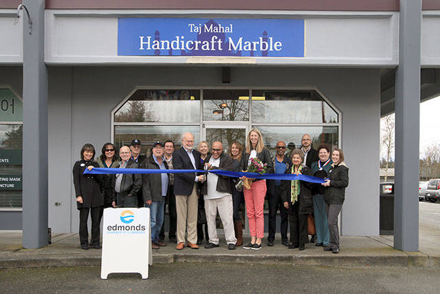 Edmonds Mayor Dave Earling helps with the ribbon cutting of the new Taj Mahal Handicraft Marble. (Contributed photo)
