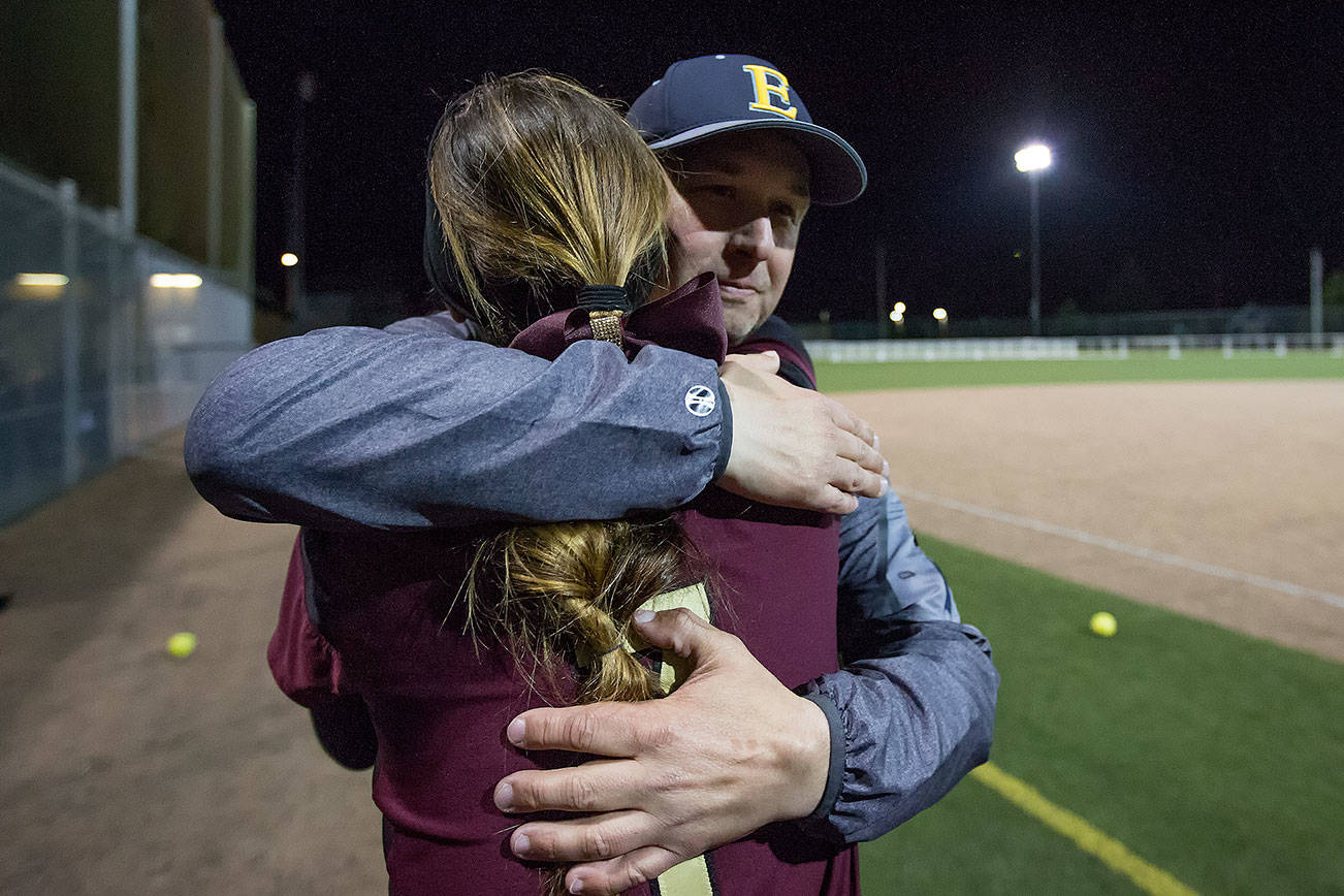 Father, daughter in opposite dugouts in softball game