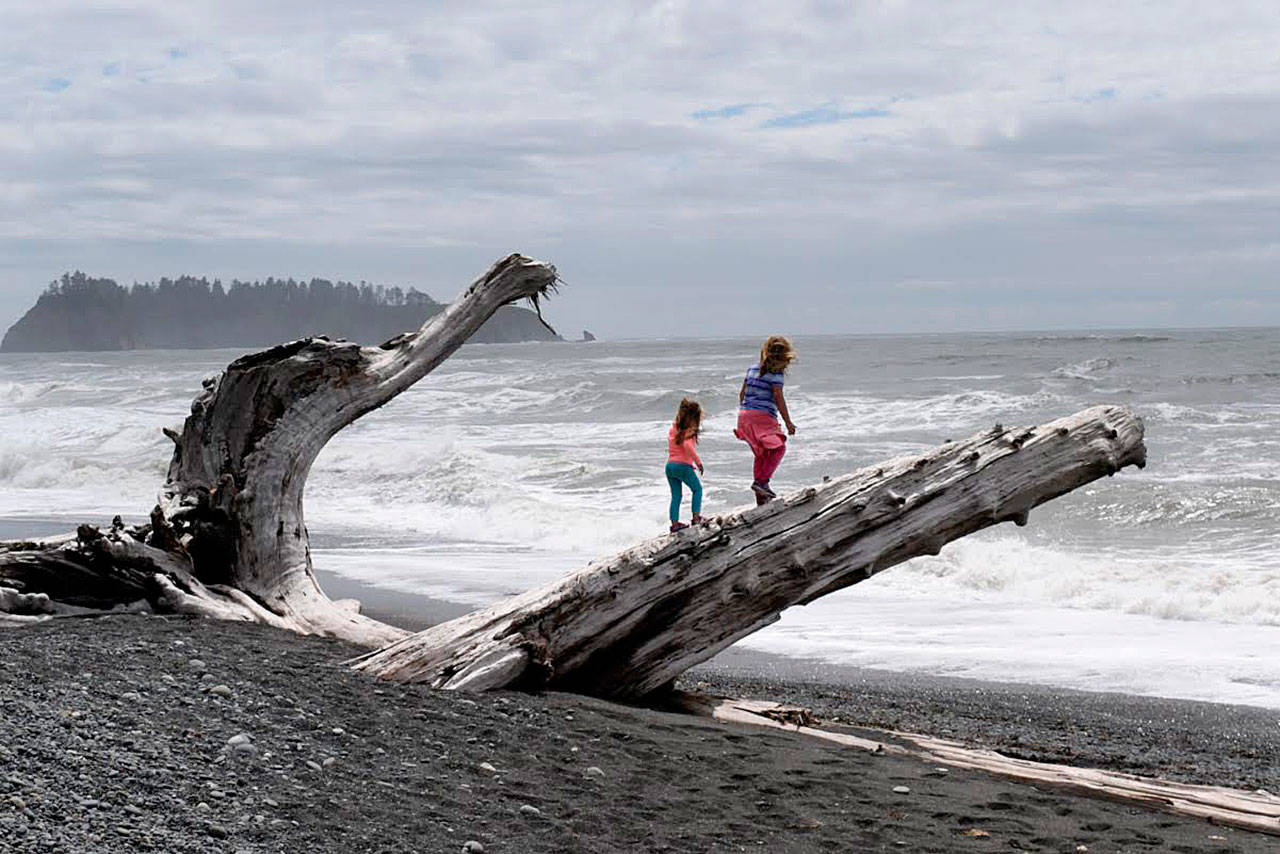 Arlington podcaster Rudy Giecek’s daughters Reggie, 4, and Raichel, 8, on the Pacific Coast hiking Rialto Beach to Hole-in-the-Wall. They go on weekly hikes with him. He has done about 50 podcast episodes since starting Cascade Hiker Podcast a year ago. (Photo by Rudy Giecek)