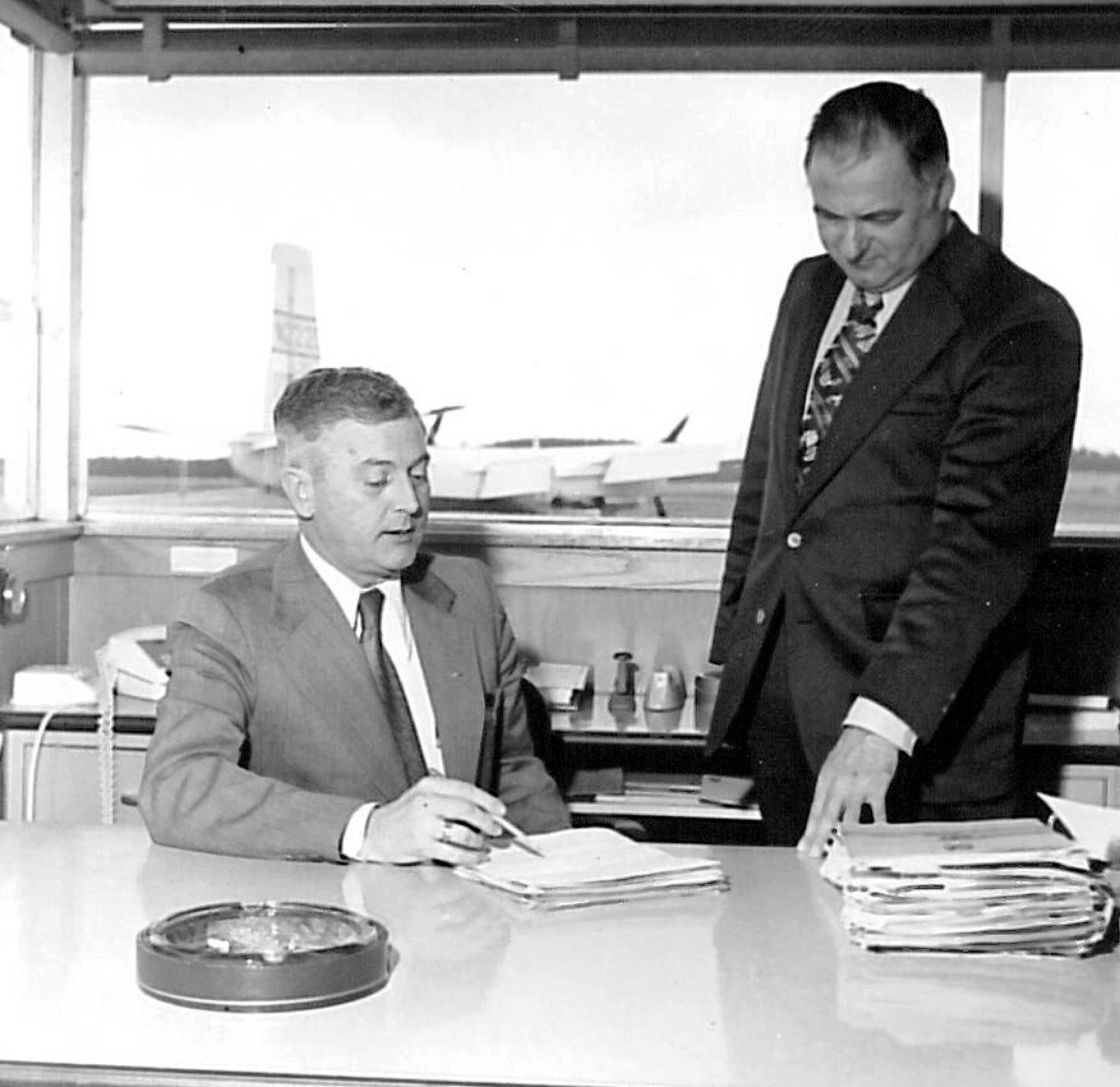 Airport director George Petrie (left)and Don Bakken, a member of the Snohomish County Airport Commission, at Paine Field. Robert Best, Everett Herald publisher, and Petrie pitched the airport to Boeing president Bill Allen, who interrupted them. “He said they had already optioned about 700 acres. Bob and I looked at each other in amazement,” Petrie told the Herald. “He had no idea Boeing was thinking that big.”