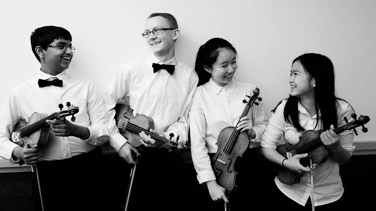 Student musicians with the Everett Youth Symphony Orchestra relax before an earlier performance this season. (Everett Youth Synphony Orchestra)