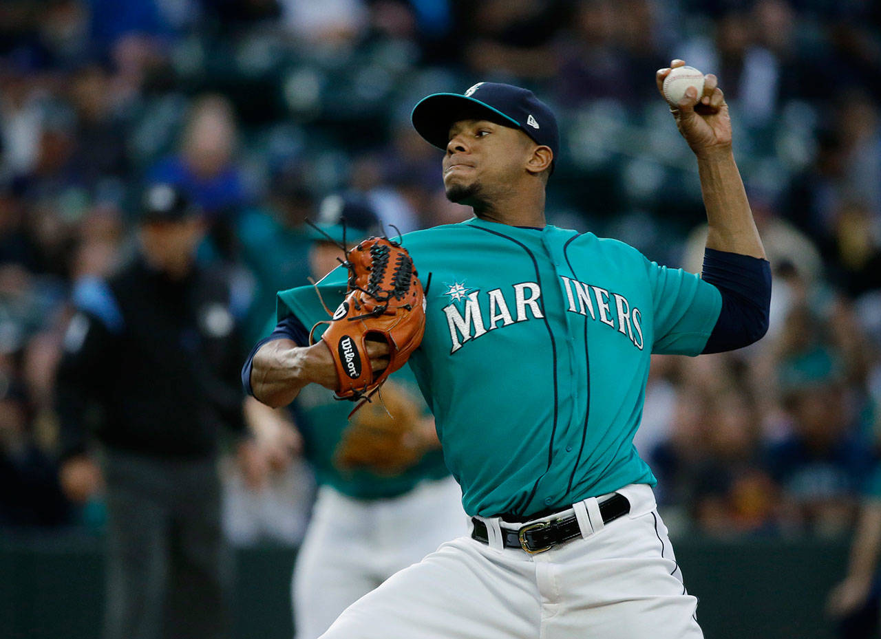 Seattle pitcher Ariel Miranda throws in the first inning of Friday’s game in Seattle. (AP Photo/Ted S. Warren)
