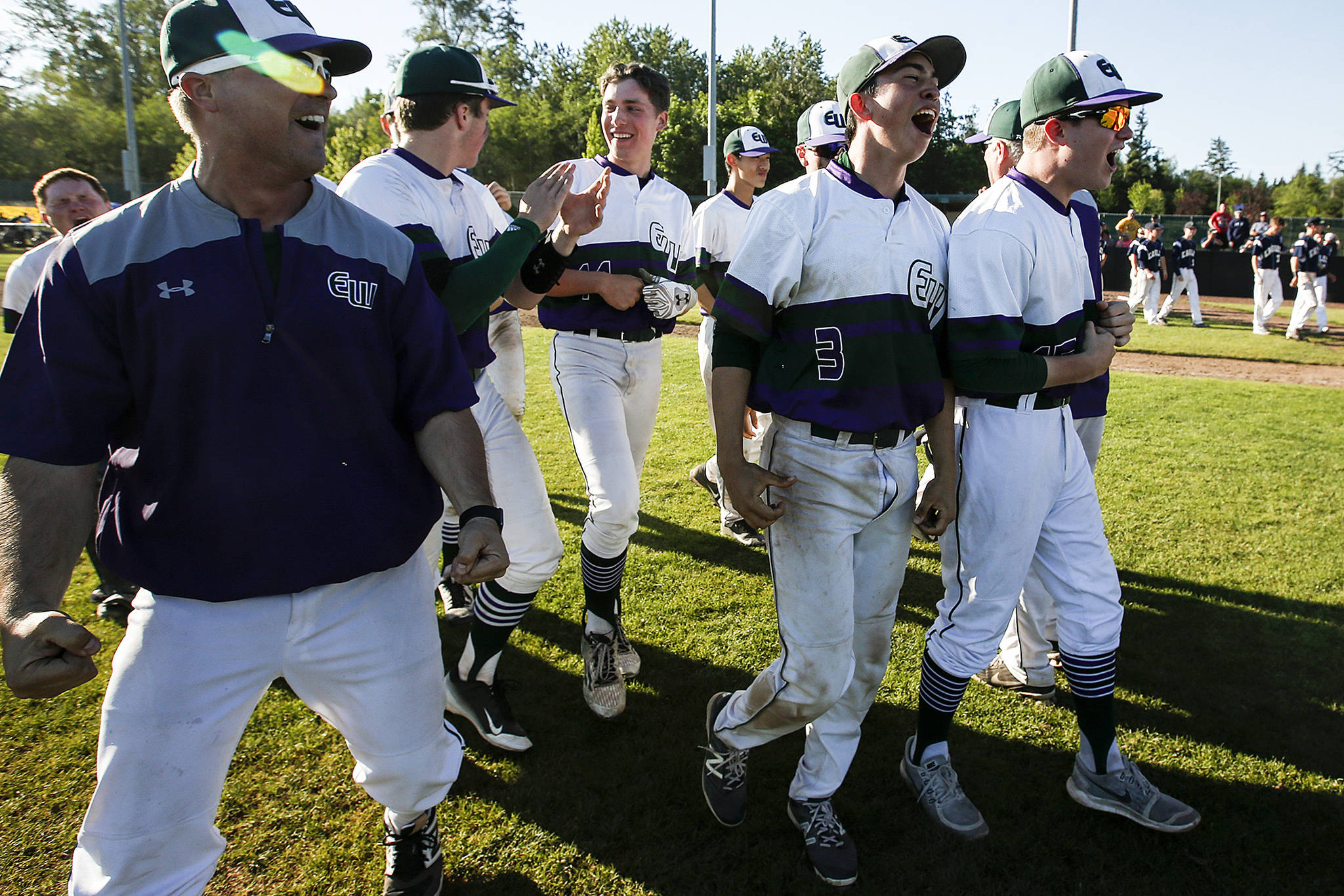 Edmonds-Woodway celebrates its 8-7 victory over Arlington in 10 innings in a 3A state playoff game on May 20, 2017, at Dream Field in Mount Vernon. (Ian Terry / The Herald)