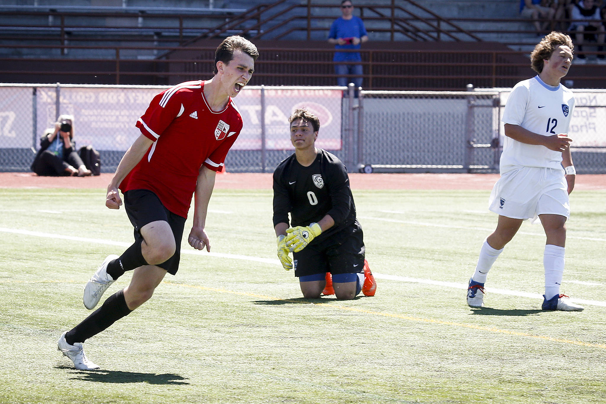 Snohomish’s Logan Stapleton (left) celebrates his second goal against Gig Harbor is a 3A state semifinal match on May 26, 2017, at Sparks Stadium in Puyallup. Snohomish beat Gig Harbor 4-3 to advance to the state championship game. (Ian Terry / The Herald)