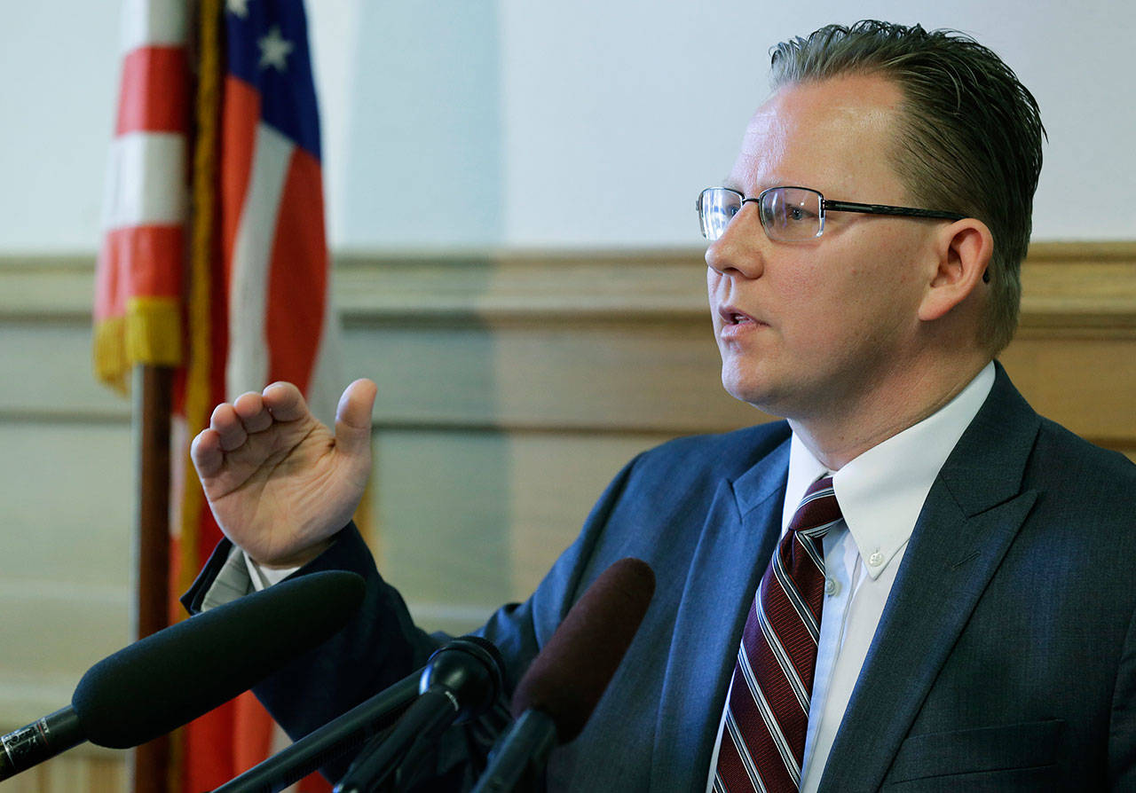 Chris Reykdal, state Superintendent of Public Instruction, talks to reporters, Wednesday in Olympia. Reykdal outlined his long-term plan for the ongoing issue of funding public education in Washington state and said lawmakers must expedite their work on satisfying the McCleary court mandate to put more money toward basic education. (Ted S. Warren/Associated Press)