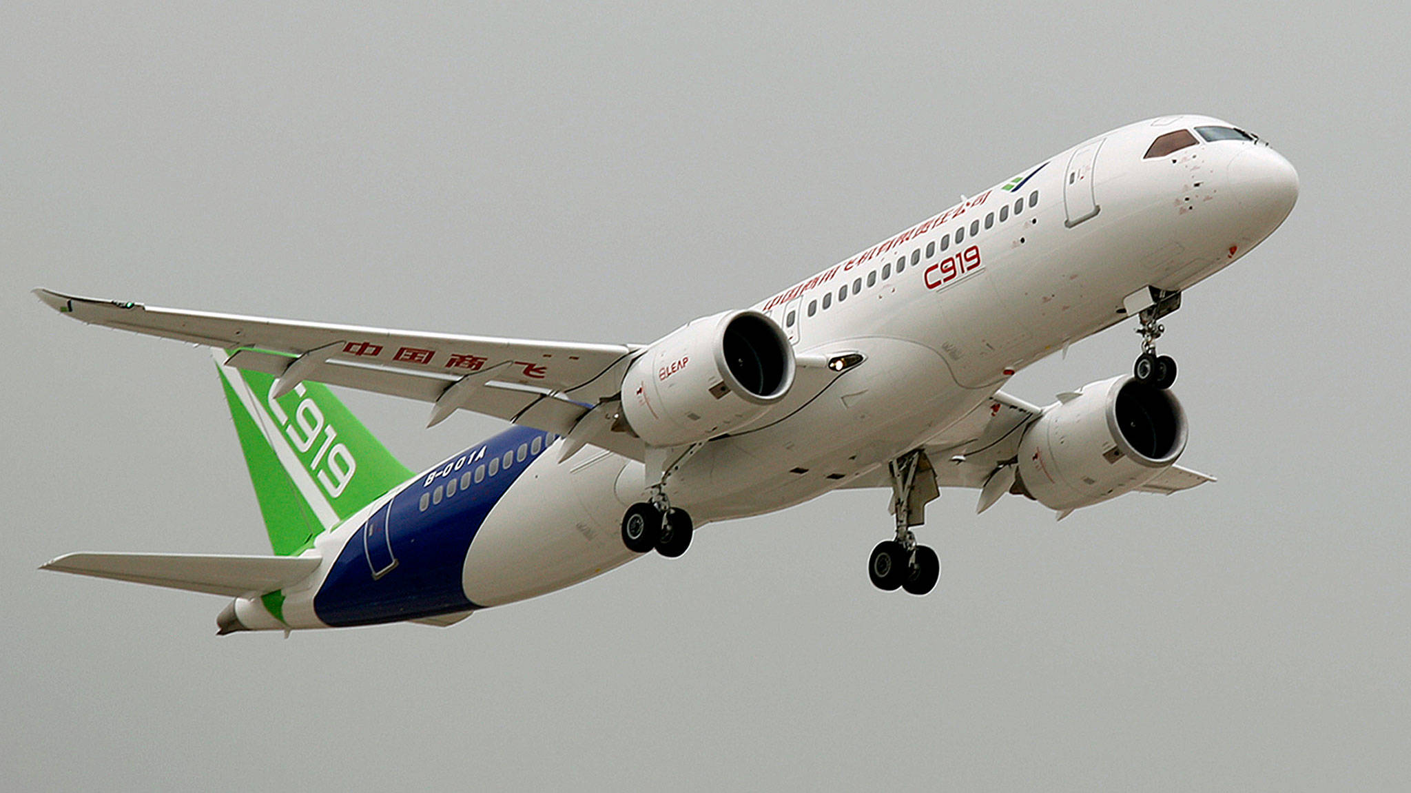 A Chinese C919 passenger jet takes off on its maiden flight at the Pudong International Airport in Shanghai on Friday. China is touting the C919 as a rival to the Airbus A320 and Boeing 737. The plane was originally due to fly in 2014 before being delivered to buyers in 2016, but has been beset by delays blamed on manufacturing problems. (Chinatopix Via AP)