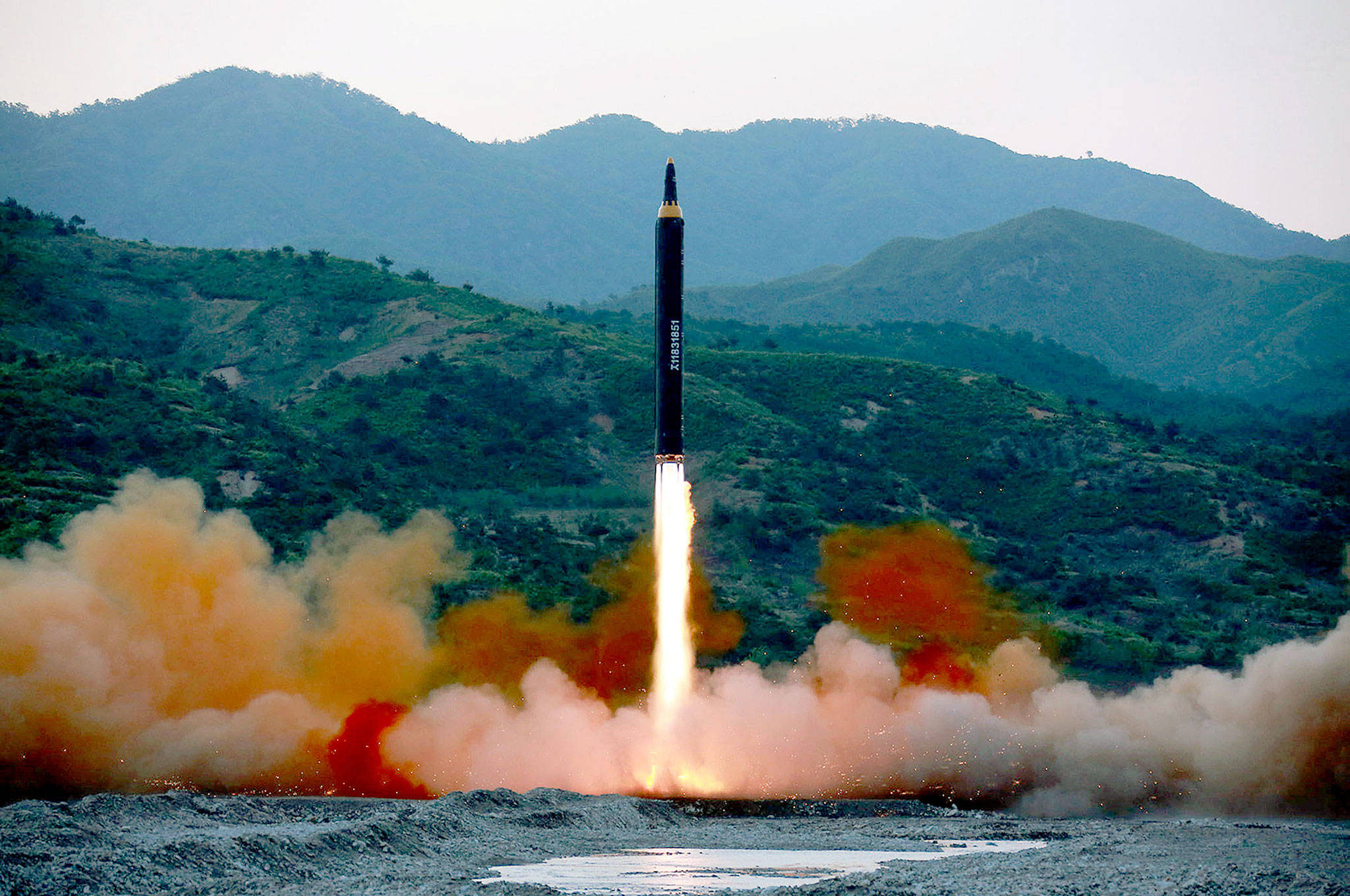 A photo distributed by the North Korean government shows the “Hwasong-12,” a new type of ballistic missile, at an undisclosed location in North Korea. North Korea on Monday boasted of a successful weekend launch of a new type of “medium long-range” ballistic rocket that can carry a nuclear warhead. Outsiders also saw a significant technological jump, with the test-fire apparently flying higher and for a longer time period than any other such previous missile. Independent journalists were not given access to cover the event depicted in this photo. (Korean Central News Agency/Korea News Service via AP)