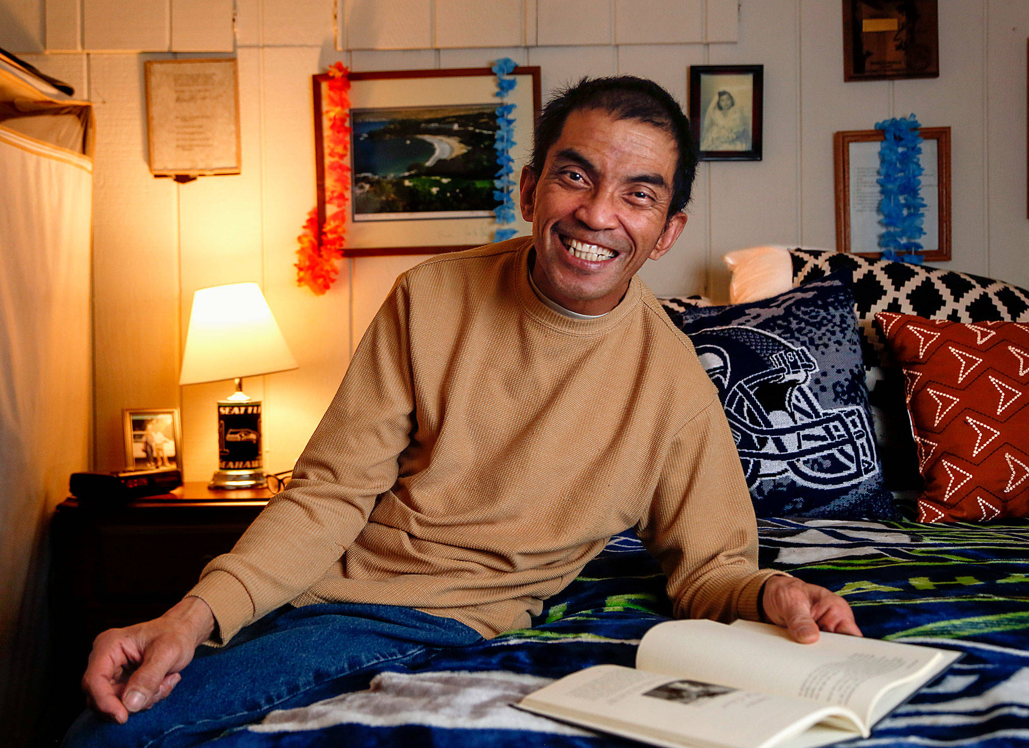 Adrian Patayon has a book signing on May 24 hosted by Arc of Snohomish County, an organization that supports people with disabilities and their families. Patayon, who has cerebral palsy and deals with depression and alcoholism, is the author of the book “Adrian’s Aloha Song.” (Dan Bates / The Herald)