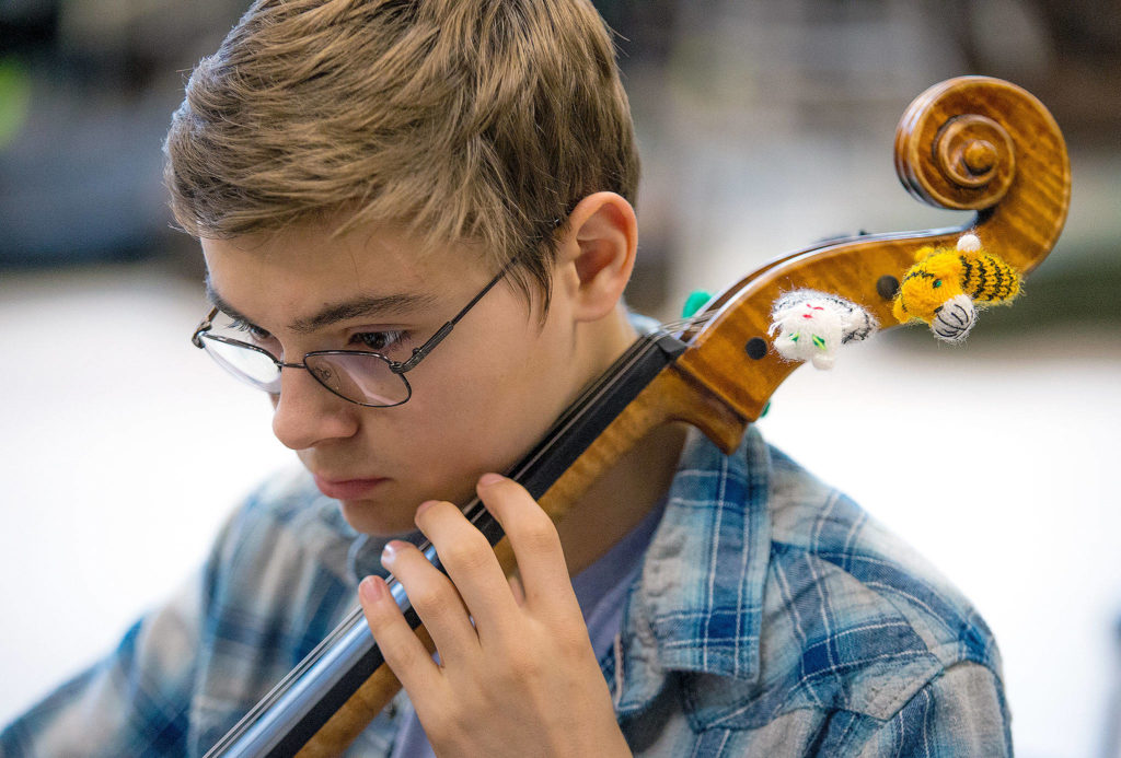 Ryan Ingham practices for the Everett Youth Symphony Orchestra at Henry M. Jackson High on May 8 in Mill Creek. (Andy Bronson / The Herald)
