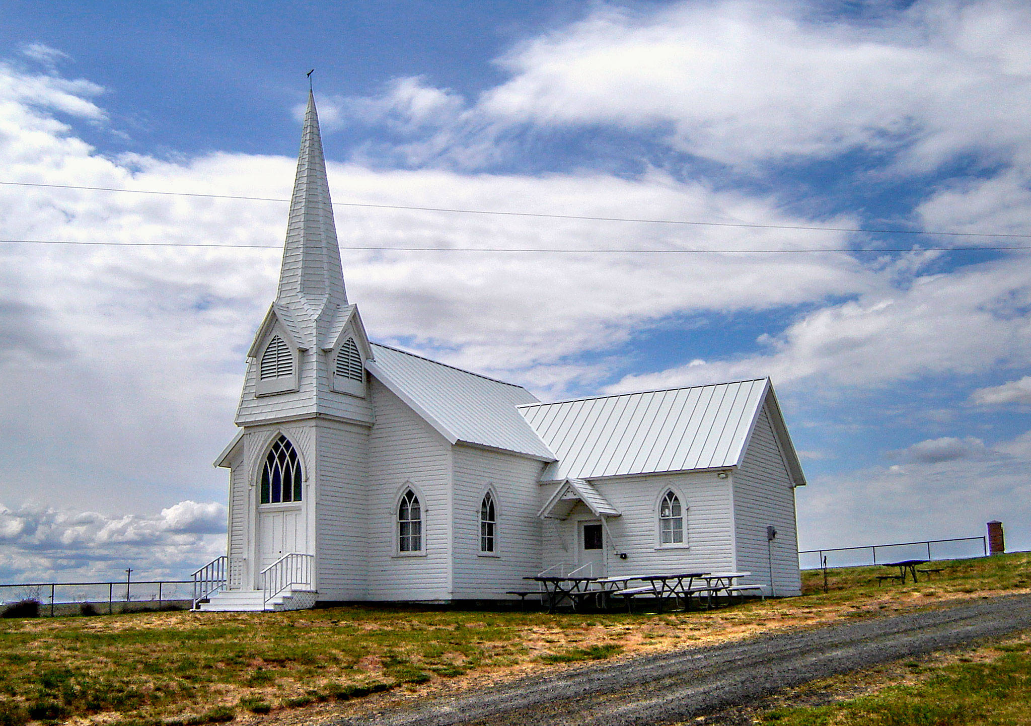 The Sherman Church, surrounded by farm country in Eastern Washington’s Lincoln County, is next to the small Sherman Cemetery where Julie Muhlstein’s grandmother is buried. The old church still holds a Memorial Day service and gathering every year. (The Wilbur Register photo)