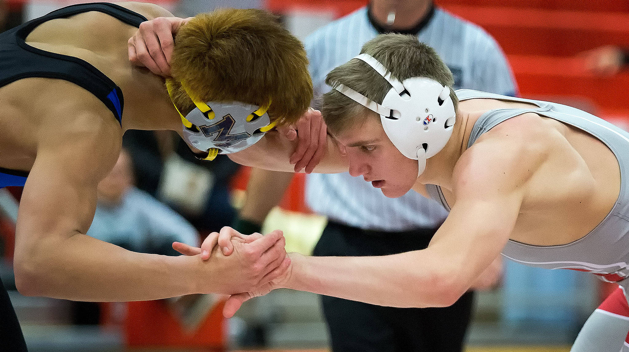 Stanwood’s Mason Phillips (right) battles Mariner’s Josh Giron in a match on Jan. 17, 2017, in Stanwood. (Andy Bronson / The Herald)