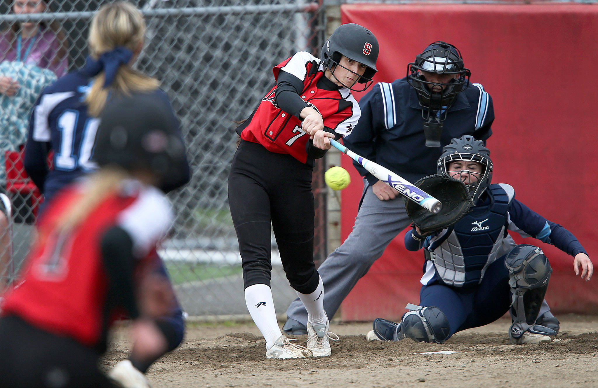Snohomish’s Bailey Greenlee hits a three-run triple during a game against Meadowdale on April 25, 2017, in Snohomish. (Andy Bronson / The Herald) ​