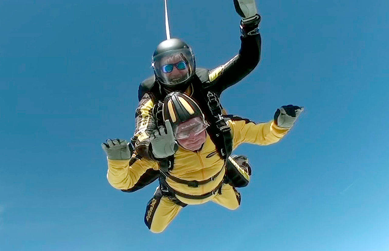 Verdun Hayes tandem-skydives in Devon, England, on Sunday. The 101-year-old D-Day veteran set the world record for the oldest tandem skydiver. (Skydive.buzz via AP)