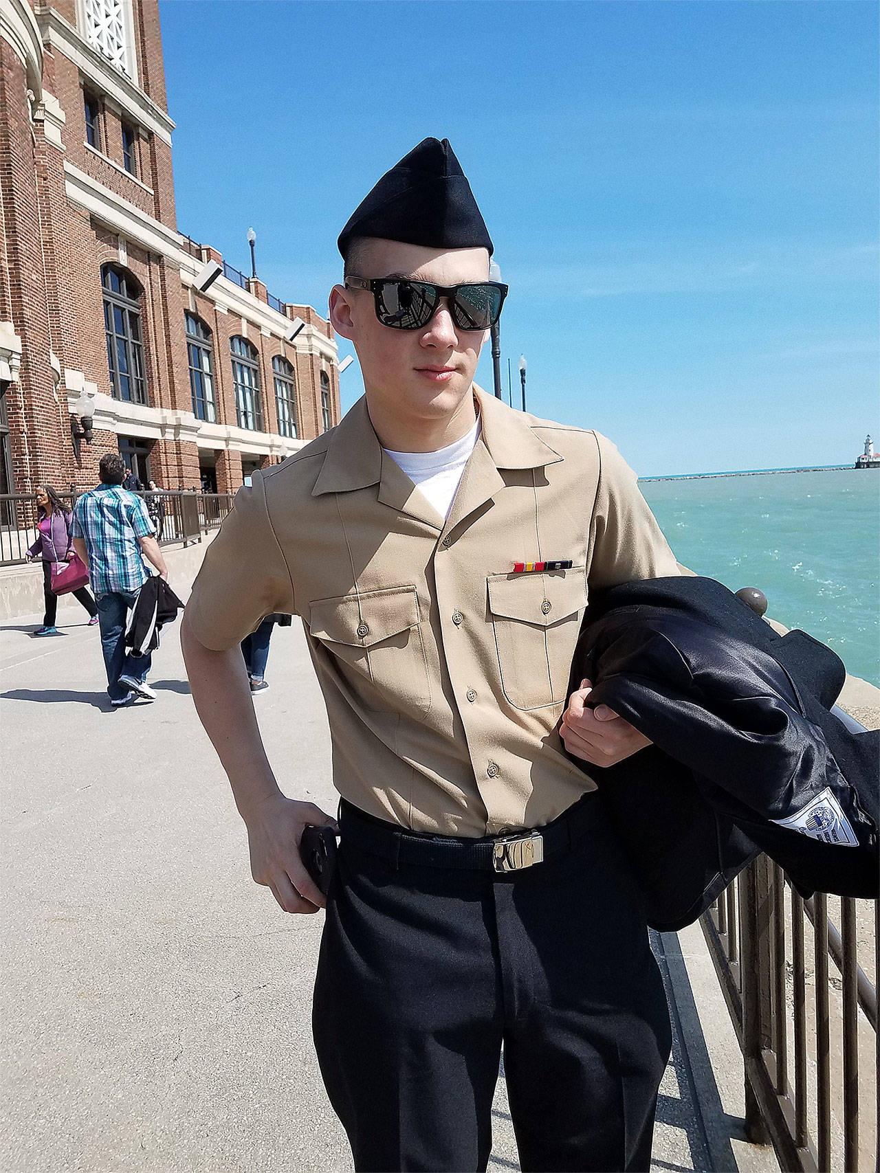 Christopher Hamblett stands on the Navy Pier in Chicago on April 7 after graduating from basic training with the U.S. Navy. (Contributed photo)