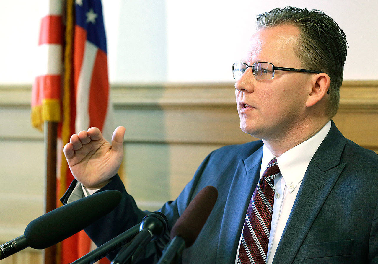 Chris Reykdal, Washington’s superintendent of public instruction, talks to reporters on Wednesday in Olympia. (AP Photo/Ted S. Warren)