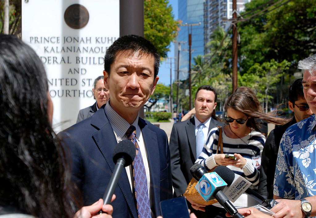 Hawaii Attorney General Douglas Chin speaks outside federal court in Honolulu, Hawaii, in March. (AP Photo/Caleb Jones, File) 
