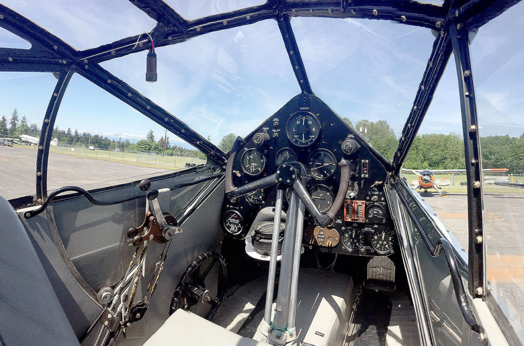The de Havilland Dragon Rapide had a cramped interior, with room for one pilot and up to eight passengers. The twin-engine biplane helped connect the British Empire in the 1930s. The Historic Flight Foundation at Paine Field has one of 12 left in the world. (Dan Catchpole / The Herald)
