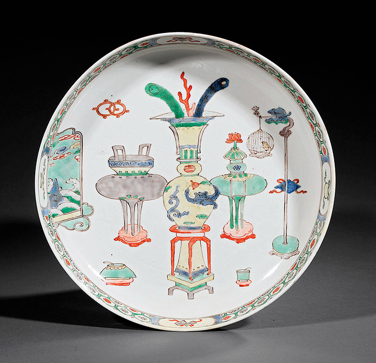 Dinnerware that pictures household objects or furnishings is not a new idea. The Chinese plate showing furniture auctioned for over $2,000. (Cowles Syndicate Inc.)