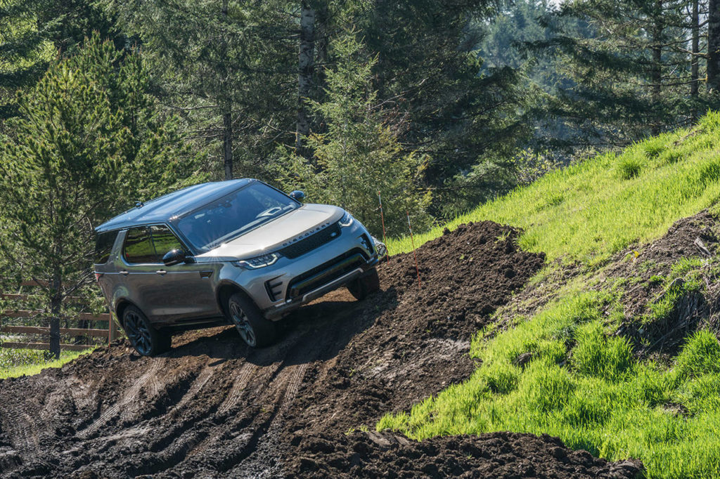 The 2017 Land Rover Discovery HSE Luxury hits a sloped section of the off-road portion at The Ridge Motorsports Park during Mudfest. It was voted best overall as the Northwest Automotive Press Association’s outdoor activity vehicle of the year and the extreme capability utility vehicle by the NWAPA. (Josh Mackey / NWAPA)
