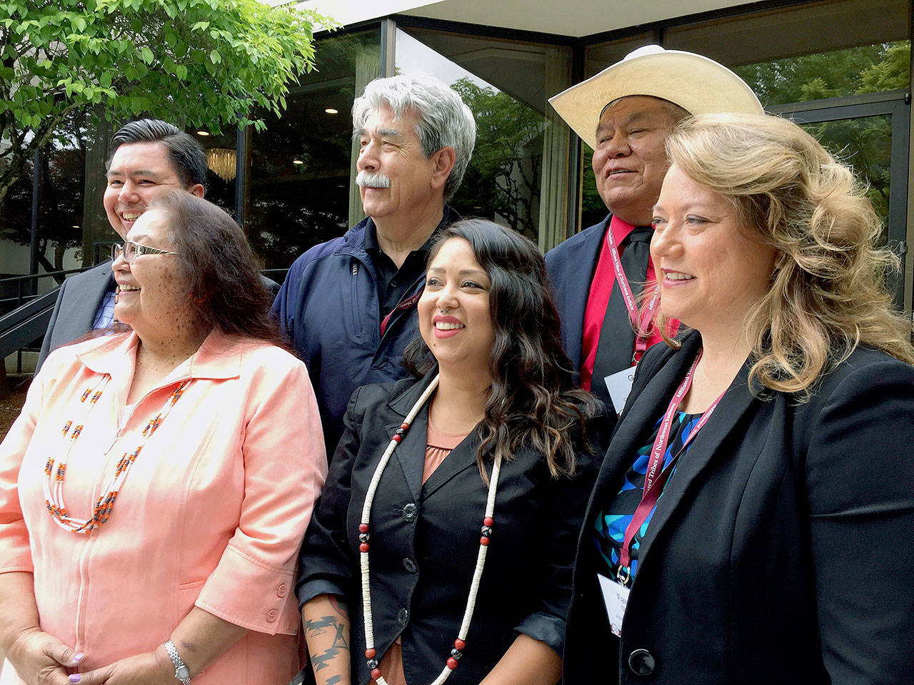 Tribal leaders from the Pacific Northwest pose for a picture during a meeting of the Members of the Affiliated Tribes of Northwest Indians in Portland on Thursday. Front row, from left: Cheryl Kennedy, vice chairwoman of the Confederated Tribes of the Grand Ronde; Carina Miller, councilwoman with the Confederated Tribes of Warm Springs; and Fawn Sharp, president of the Affiliated Tribes of Northwest Indians. Back row, from left: Timothy Ballew, member of the Lummi Nation; Mel Sheldon, councilman with the Tulalip Tribes; and Gary Burke, chairman of the board of trustees for the Confederated Tribes of the Umatilla Indian Reservation. (AP Photo/Gillian Flaccus)