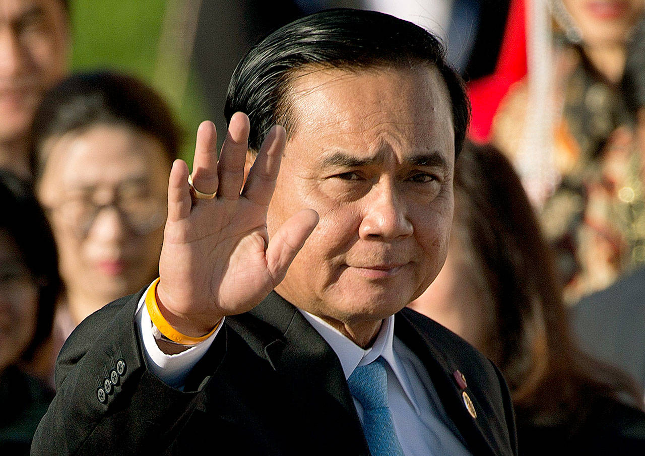 Thailand’s Prime Minister Prayuth Chan-ocha waves as he arrives in 2016 for a group photo of leaders at the 11th Asia-Europe Meeting (ASEM) in Ulaanbaatar, Mongolia. Three years after military leaders, led by then junta leader Prayuth, overthrew a democratically elected government in Thailand, the country is sputtering economically, watched closely for its crackdown on political freedom and still the site of sporadic but unnerving unrest. On Monday, a bomb exploded in a military-run hospital in the Thai capital, wounding 21 people on the third anniversary of the 2014 coup. (AP Photo/Mark Schiefelbein, File)