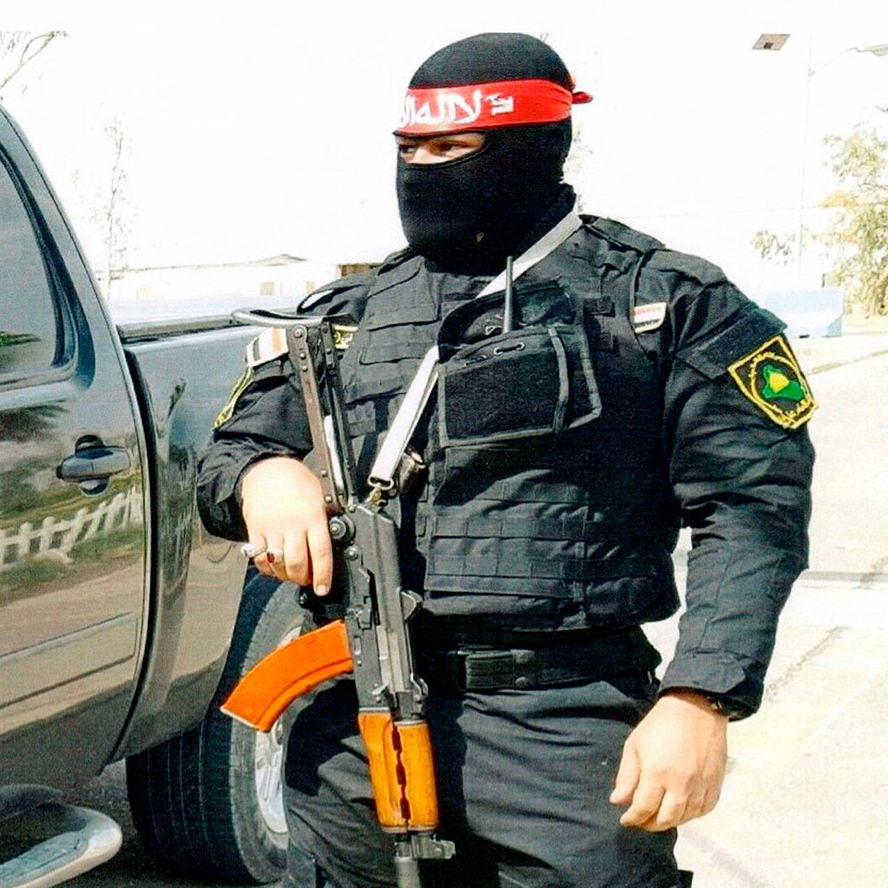 This photo obtained by The Associated Press shows an Iraqi bodyguard hired by Sallyport Global to protect VIPs. When a Toyota SUV was stolen from Balad air base, he became the chief suspect and was linked to a dangerous Iran-backed militia and was viewed by investigators as “a hard-core recruit to become a terrorist who poses a serious threat to all personnel on this base.” (Photo via AP)