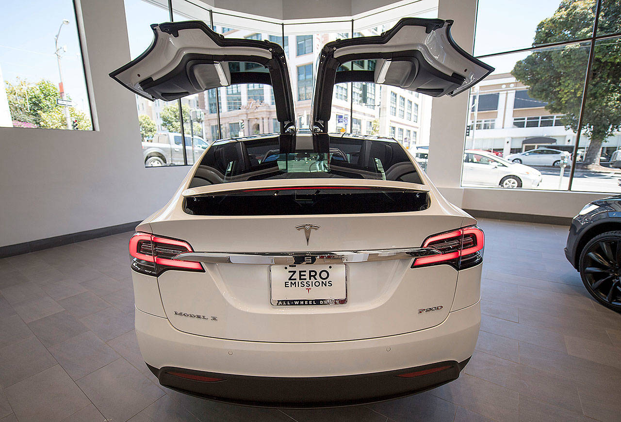 A Tesla Motors Model X is displayed at the company’s showroom in San Francisco on Aug. 10. (David Morris / Bloomberg)