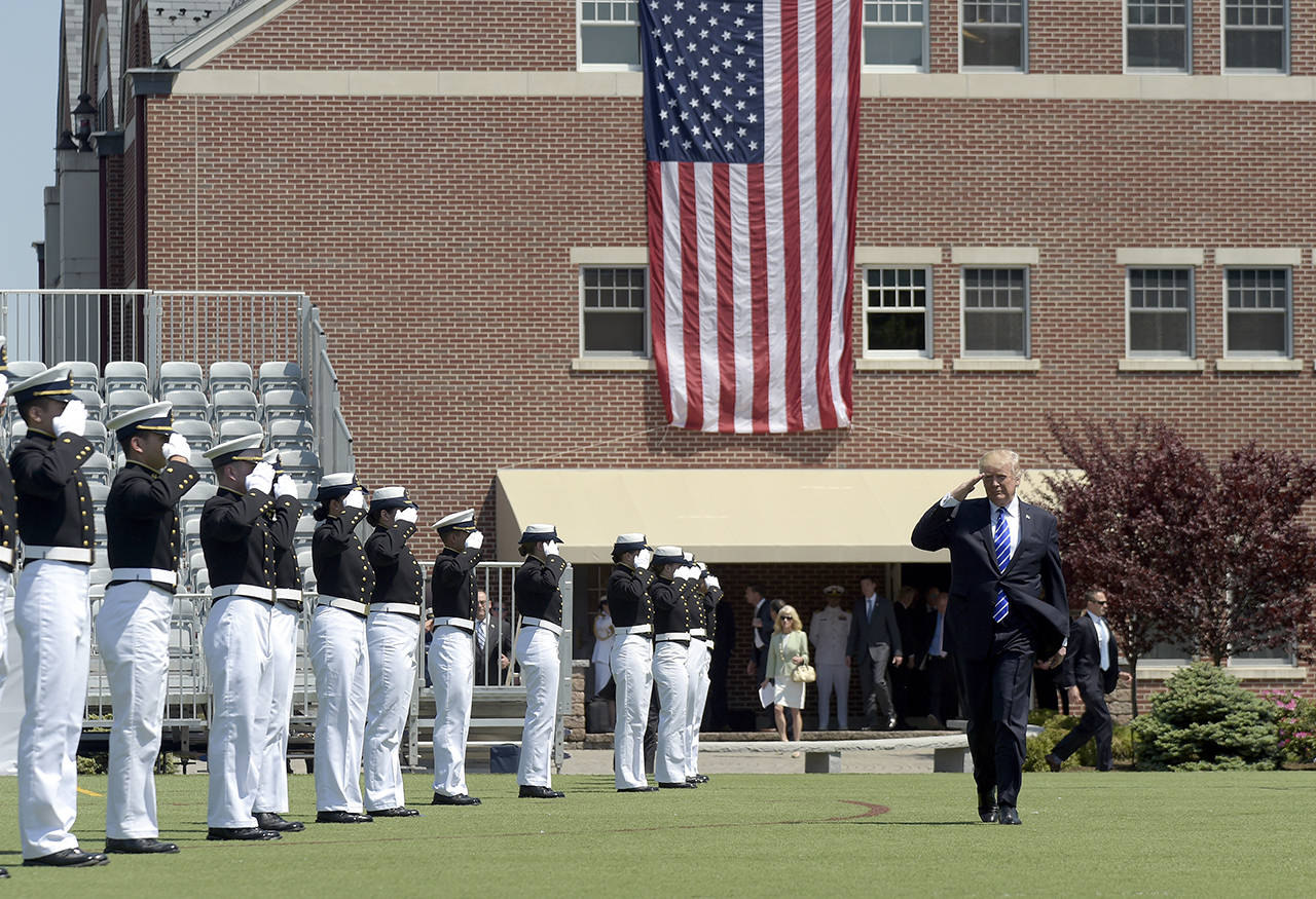 President Donald Trump salutes as he arrives to give the commencement address at the U.S. Coast Guard Academy on Wednesday, May 17, in New London, Connecticut. (AP Photo/Susan Walsh)