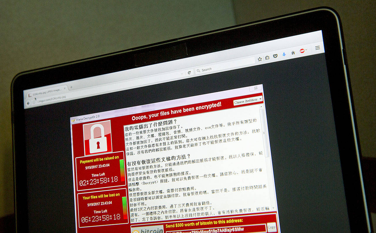The warning screen from a ransomware attack, on a computer in Taiwan on Saturday. (AP Photo/Mark Schiefelbein, File)