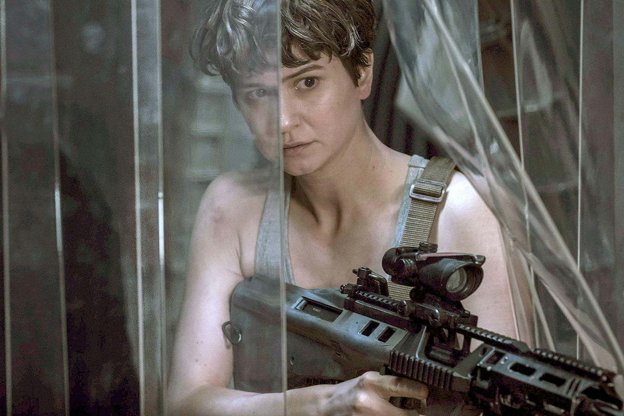 Katherine Waterston plays a member on a crew on a colony ship bound for a remote planet that discovers an uncharted paradise with a threat (above) beyond their imagination, and must attempt a harrowing escape in “Alien: Covenant.” (Mark Rogers/Twentieth Century Fox via AP)