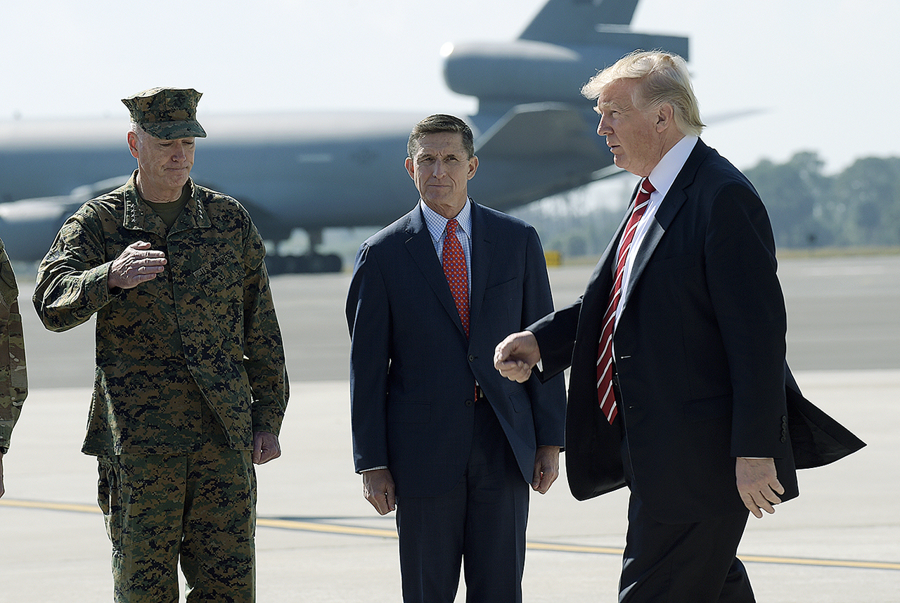 Then-National Security Adviser Michael Flynn (center) and President Donald Trump on Feb. 6. (AP Photo/Susan Walsh)
