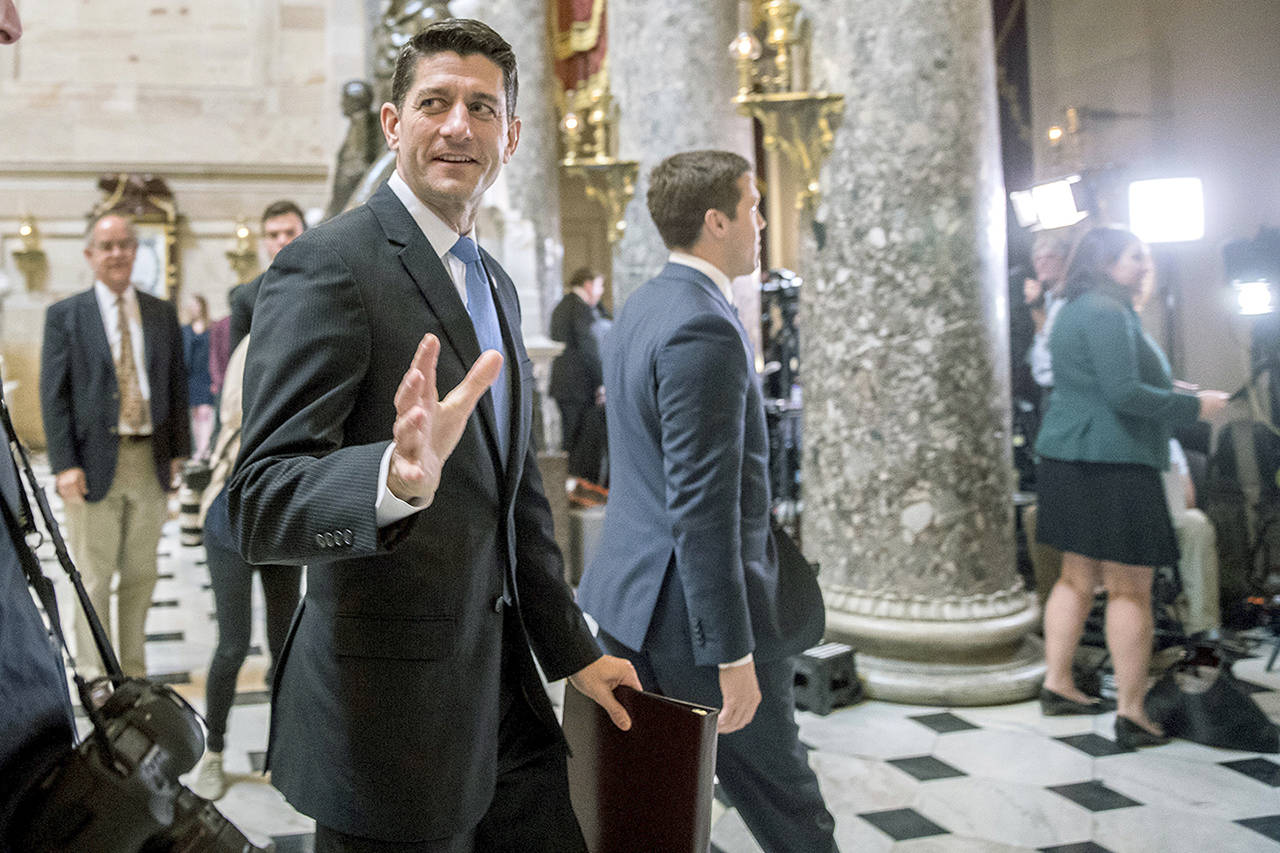 House Speaker Paul Ryan of Wisconsin greets guests as he walks to the House Chamber on Capitol Hill in Washington on Thursday, May 4. (AP Photo/Andrew Harnik)