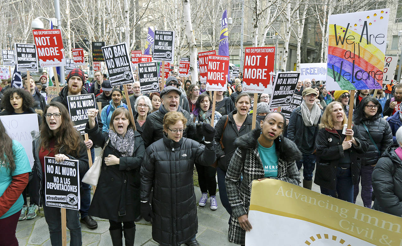 In this Feb. 17 photo, protesters chant “Free Daniel” during a demonstration outside the federal courthouse in Seattle, where a hearing was held for Daniel Ramirez Medina, a Seattle-area man who was arrested by immigration agents despite his participation in a federal program to protect those brought to the U.S. illegally as children. (AP Photo/Ted S. Warren,File)