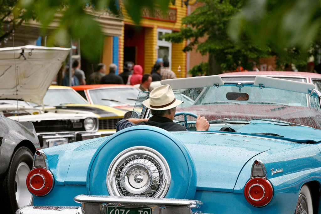 The driver of a vintage Ford Thunderbird takes part in Cruzin’ to Colby in 2013. The event returns this year May 28-29. (Herald file photo)

