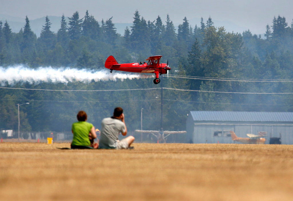 Vicky Benzing flies her 1940 Boeing Stearman during the two o’clock airshow at the Arlington Fly-In. The event returns this year July 7-9. (Herald file photo)
