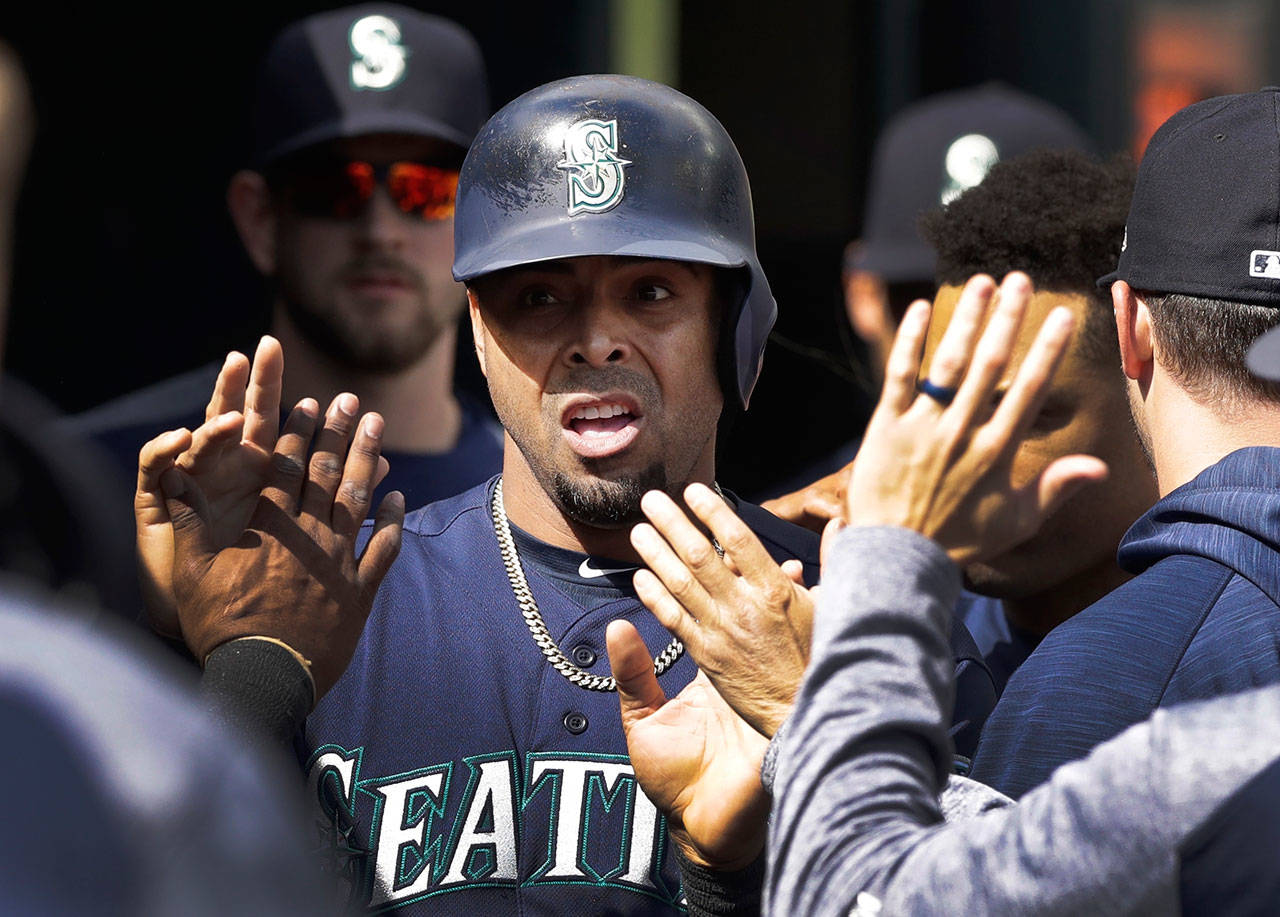 The Mariners’ Nelson Cruz is congratulated after scoring during the sixth inning of a game against the Tigers on April 27, 2017, in Detroit. (AP Photo/Carlos Osorio)