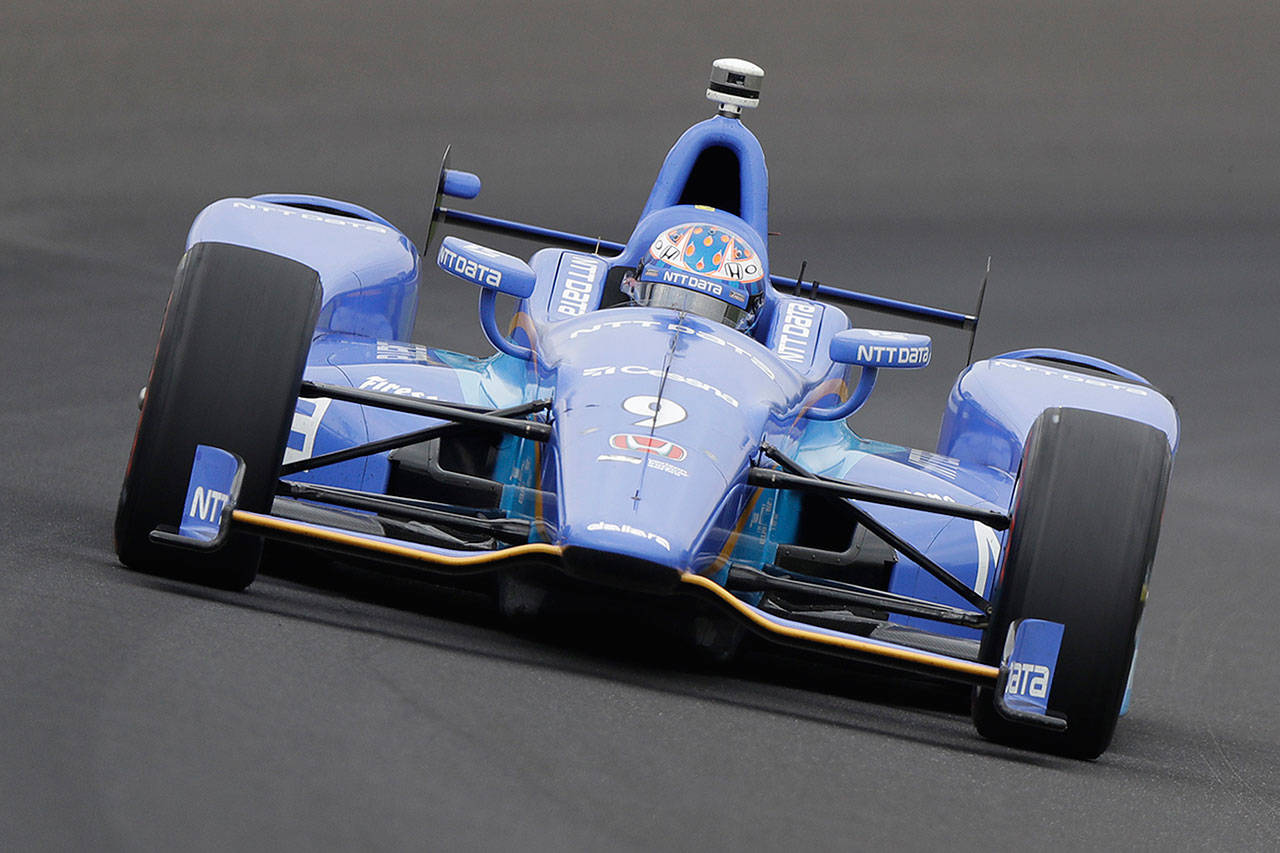 New Zealand’s Scott Dixon drives into turn one during a practice session for the Indianapolis 500 on Friday at Indianapolis Motor Speedway. (AP Photo/Darron Cummings)