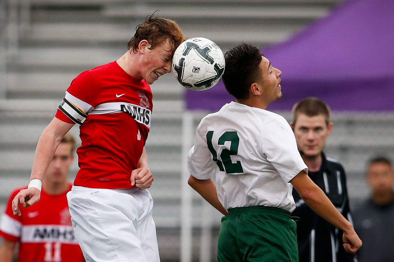 Archbishop Murphy’s Matt Williams (left) and Quincy’s Francisco Alejandrez go up for a header during the 2A championship game last season in Sumner. (Ian Terry / The Herald)
