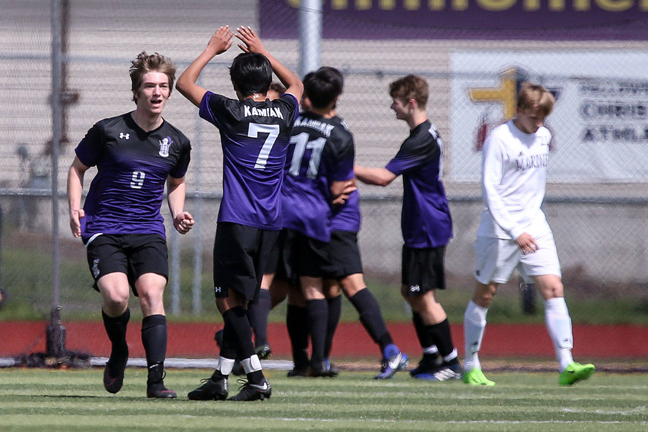 Kamiak players celebrate a goal during a 4A district playoff game against Mariner on May 13, 2017, in Lake Stevens. Kamiak won 2-1. (Kevin Clark / The Herald)
